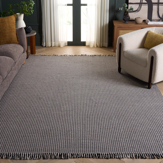 SAFAVIEH Montauk Collection Area Rug - 9' x 12', Ivory & Black, Handmade Flat Weave Boho Farmhouse Cotton Tassel Fringe, Ideal for High Traffic Areas in Living Room, Bedroom (MTK340D)